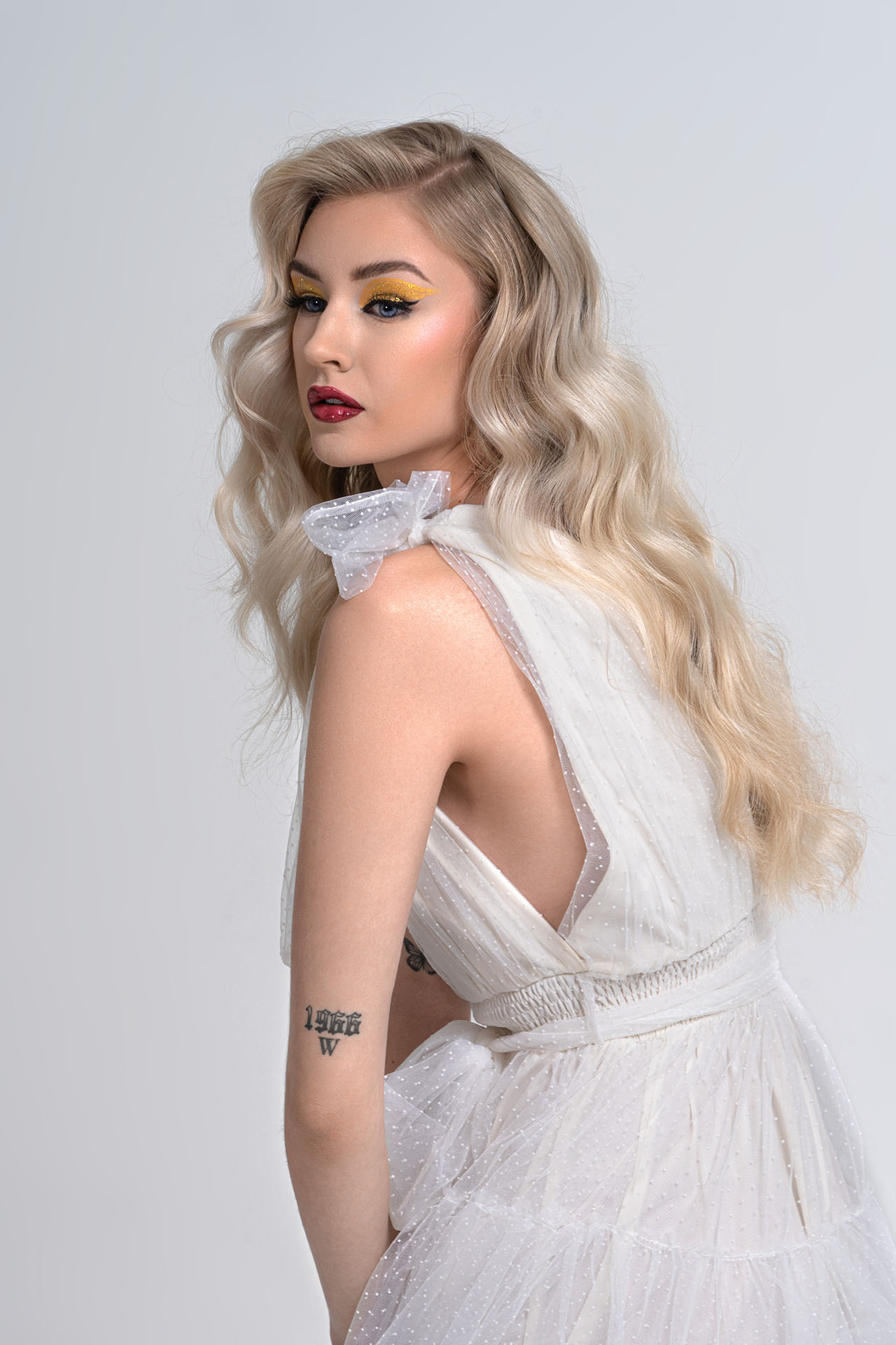 Valentine’s Shoot Photography 12 Blonde model in a flowing white gown, romantic side-profile studio portrait