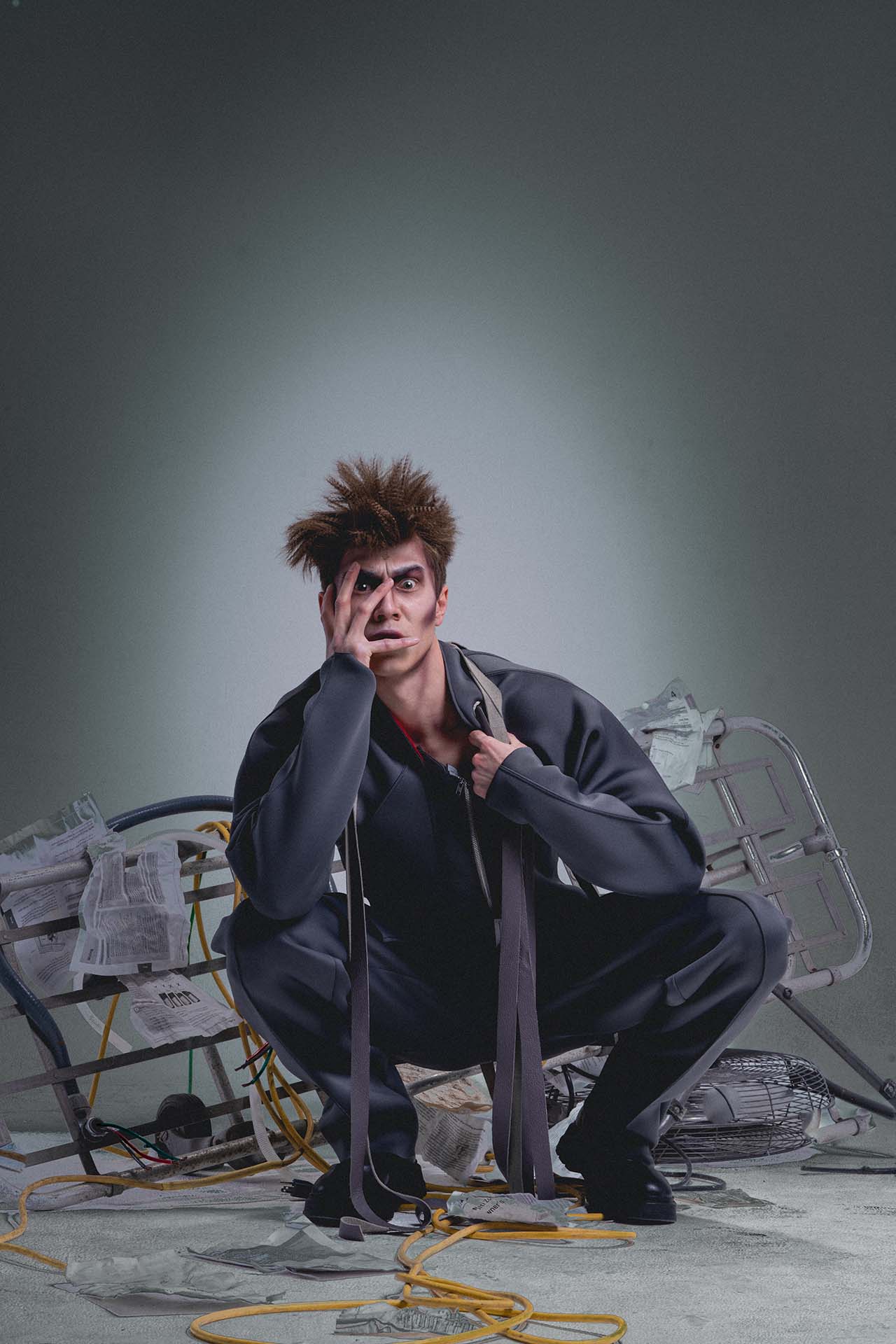 Dramatic character portrait of a man seated on a metal wheelchair-like structure, dystopian styling