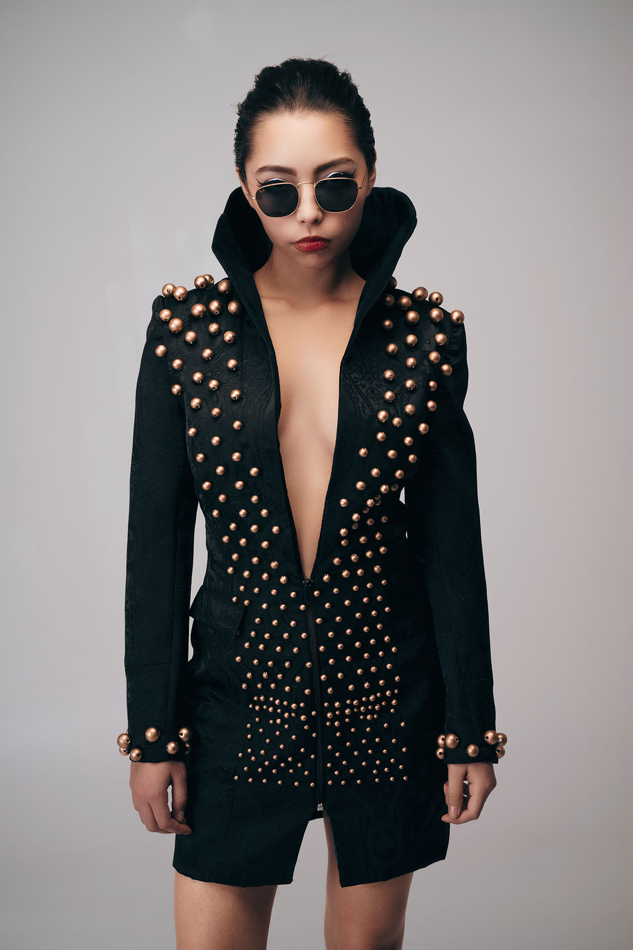 Mauro Look Book Photography 02 Model in a plunging black studded blazer and sunglasses, standing studio portrait