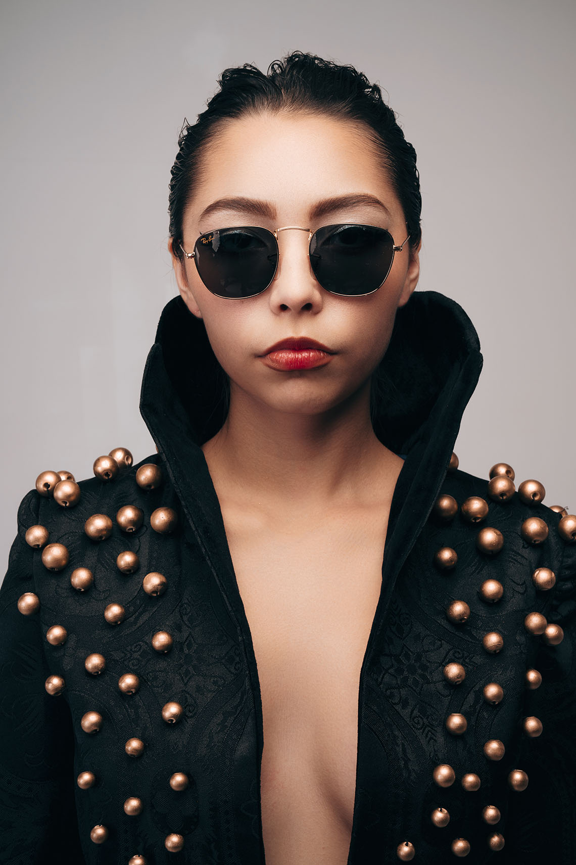 Mauro Look Book Photography 04 Close portrait of a model in a black studded blazer and sunglasses