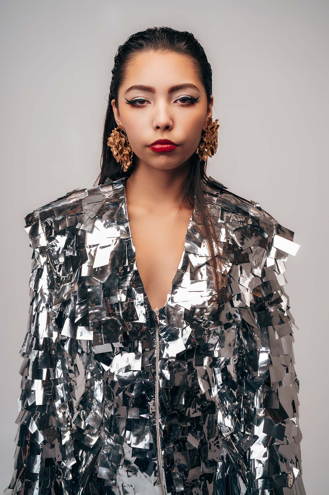 Mauro Look Book Photography 11 Close portrait of a model in a sequined jacket with statement earrings