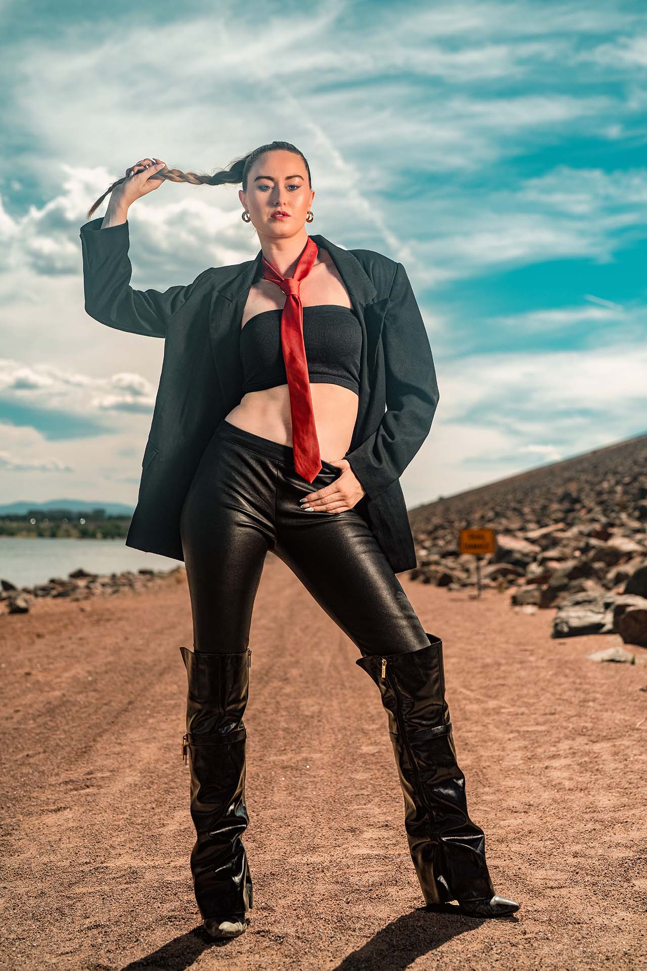 Ashlee with a red scarf blowing in the wind at Cherry Creek Reservoir, low water level