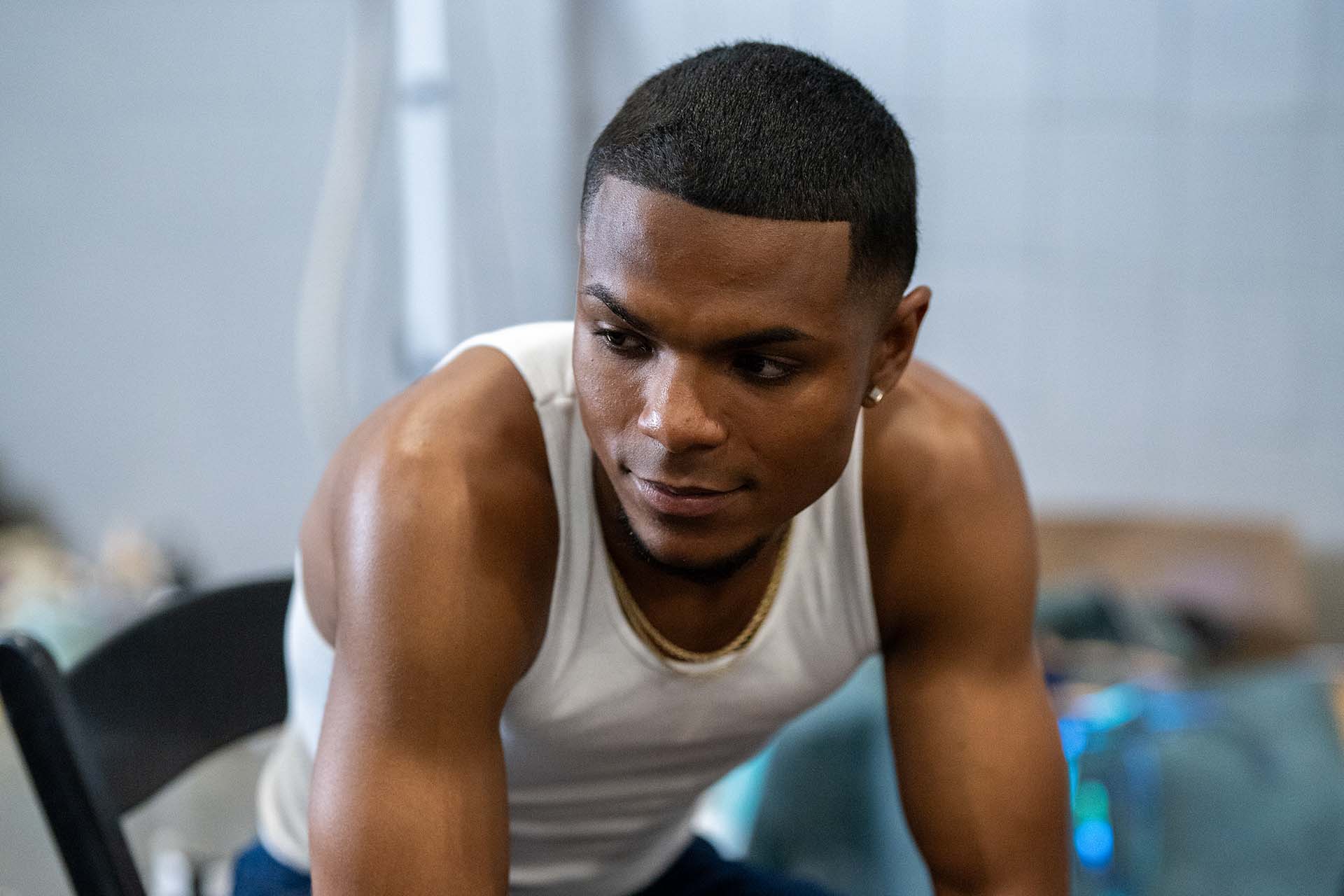 Close portrait of a male model in a tank top, backstage at Denver Fashion Week