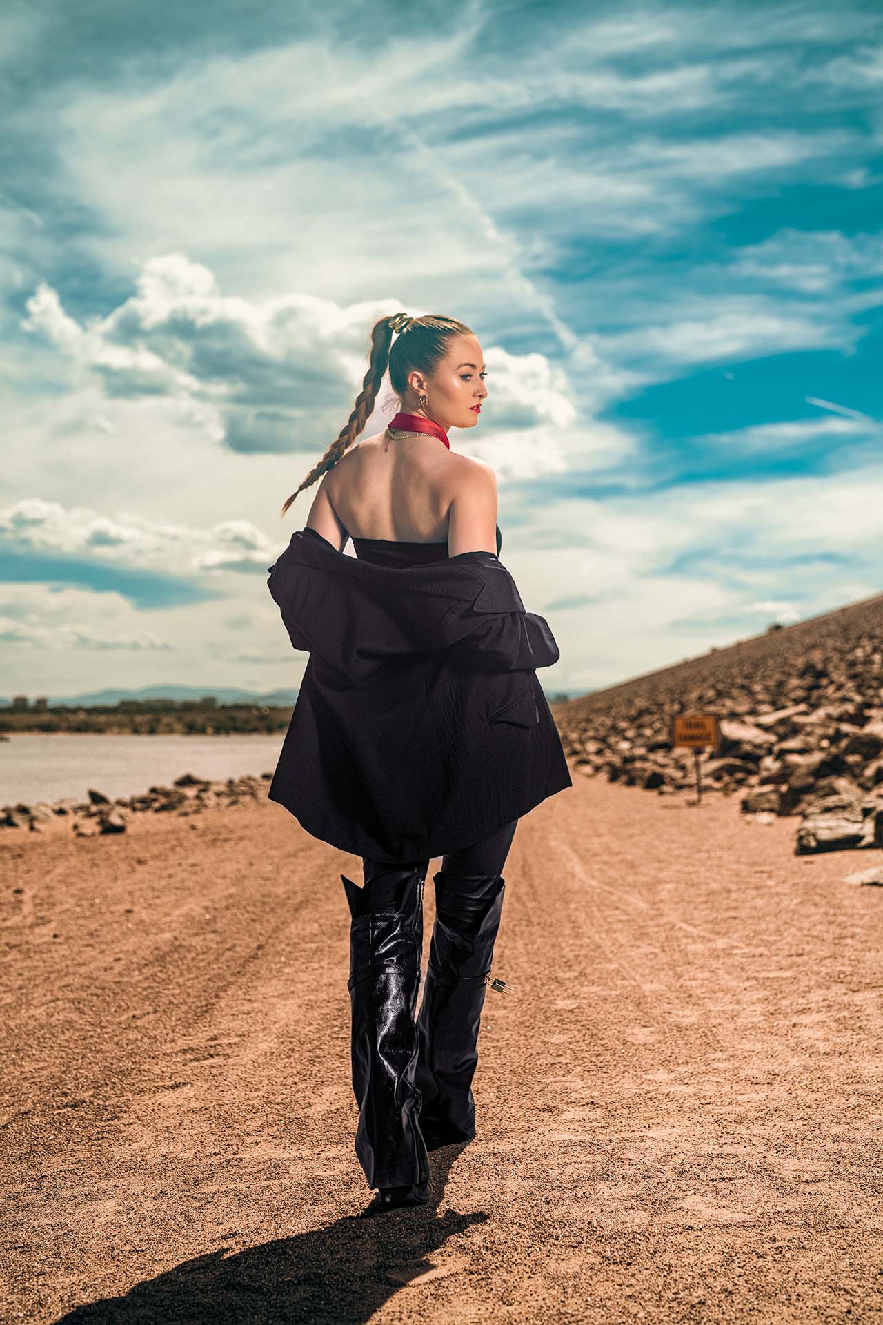 Ashlee in a black blazer and slacks on the walkway at Cherry Creek Reservoir, midday