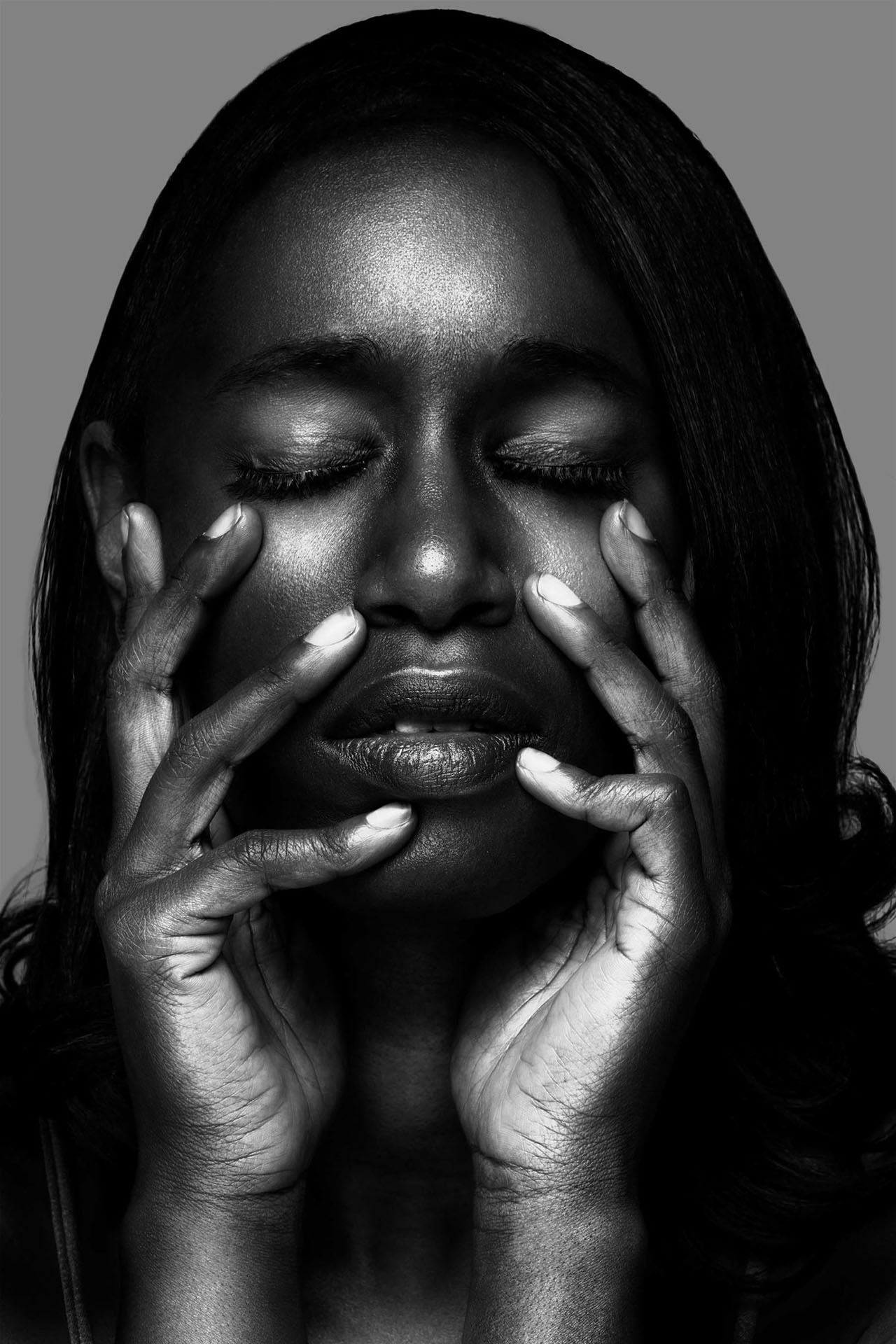 Black-and-white fine-art portrait with hands framing the face, Denver photography